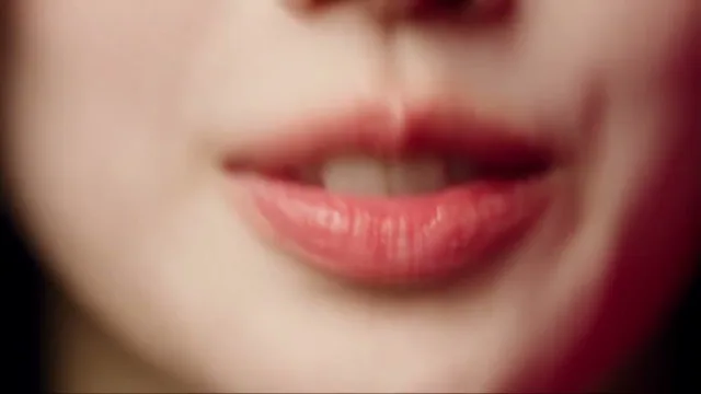 APT AI video storyboard still of a face in the pink studio
