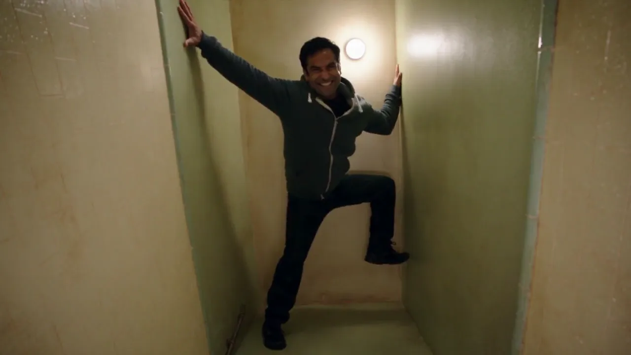 Person braced in the bathroom walls