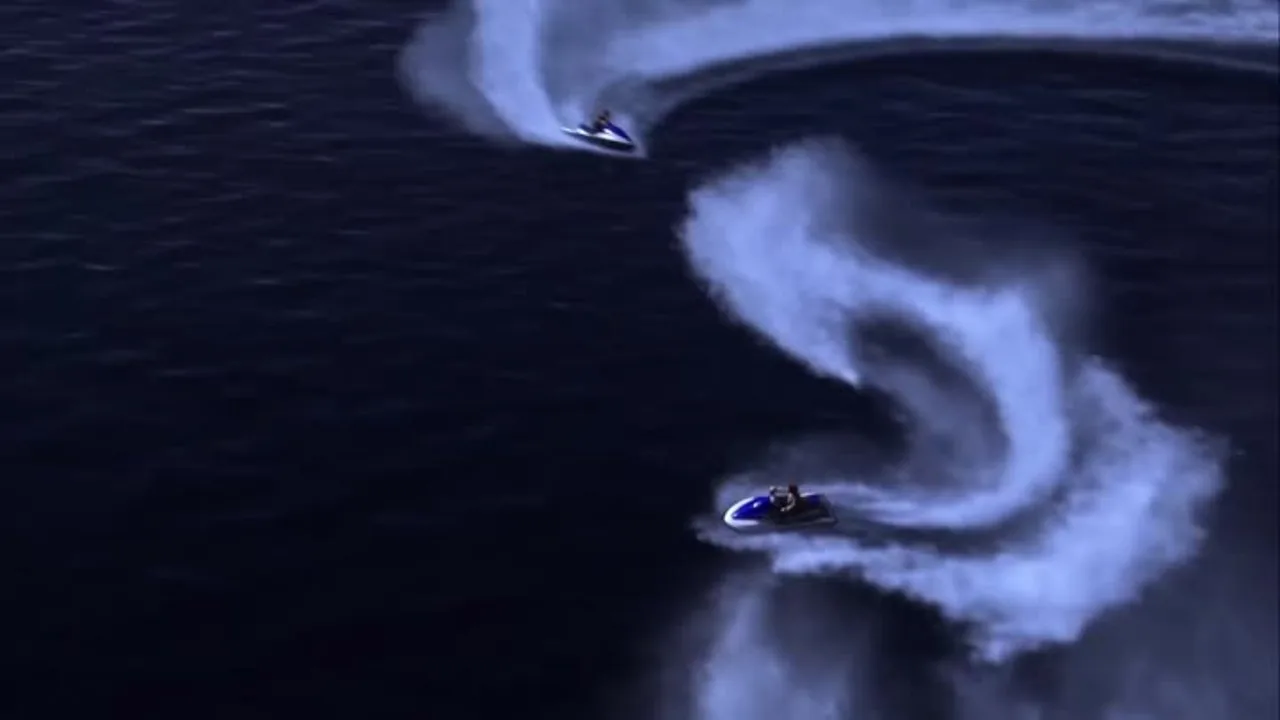 Top-down shot of a jet ski carving white wake