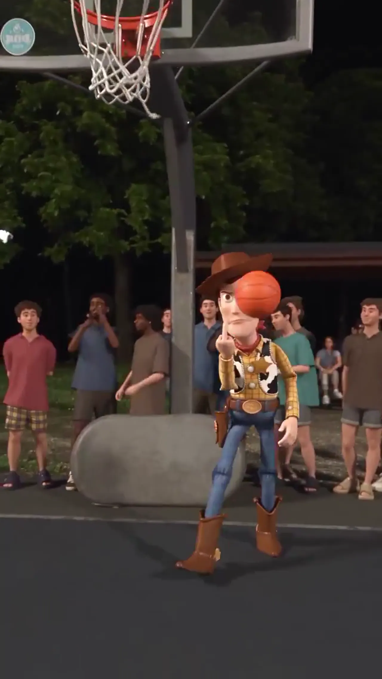 Woody stands under the hoop with a finger raised