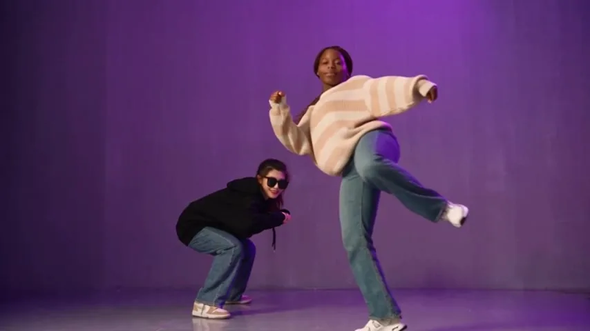 High kick against a low crouch pose
