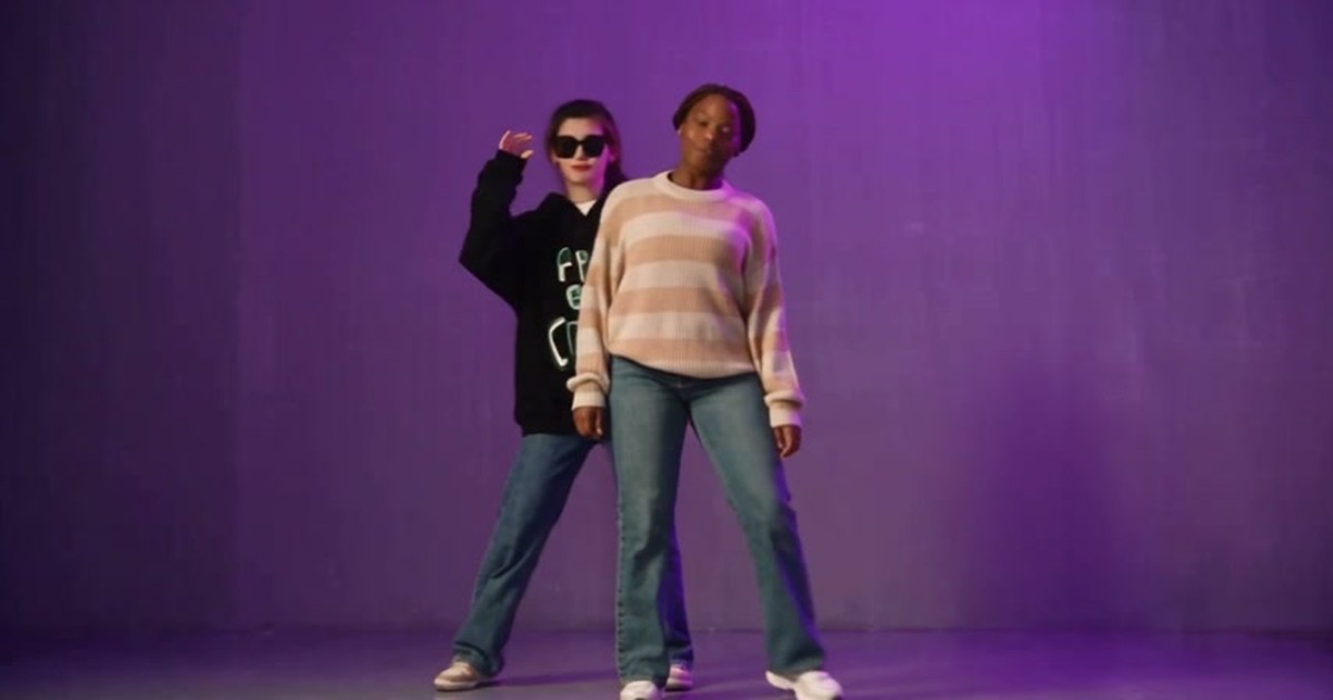 NEON AI video showcase: two dancers in a purple studio
