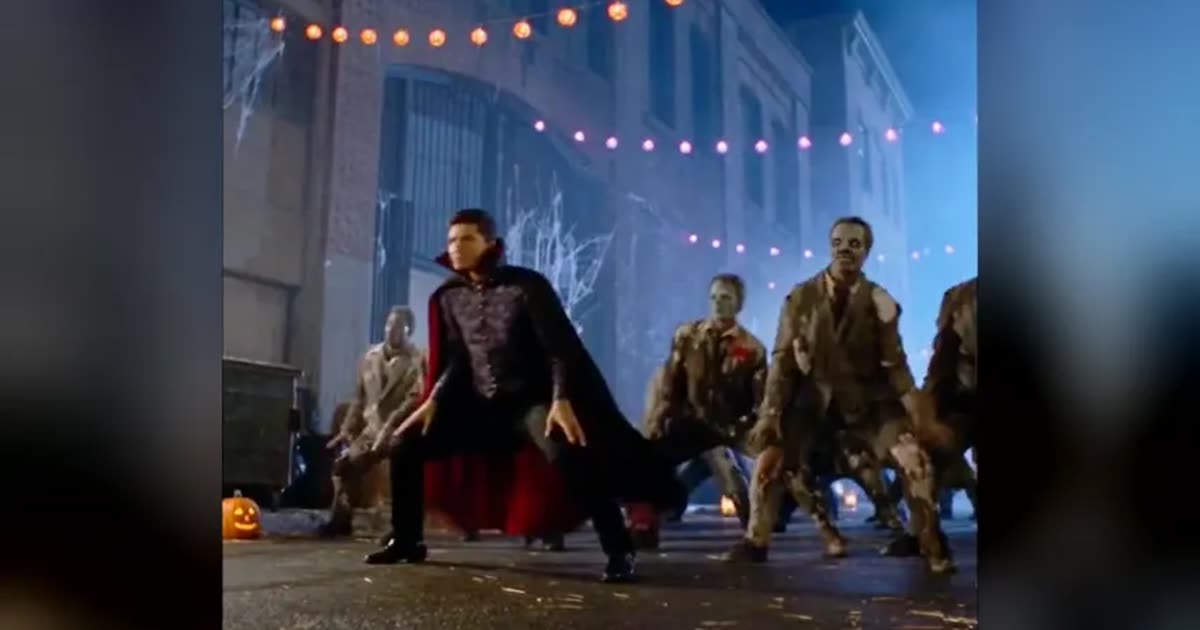 Thriller Halloween AI showcase: Thriller-style zombie routine on a string-lit night street